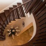 circular-stair-case-custom-make-nosing-hardwood-installtion-metal-spindles-wood-posts-shelf-landing-white-stringers-curved-nosing-installation-in-mississauga