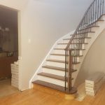 circular-stair-white-riser-white-stringers-wrought-iron-spindles-gta-mississauga-newmarket-aurora-richmondhill